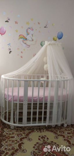 Детская кроватка с продольным маятником