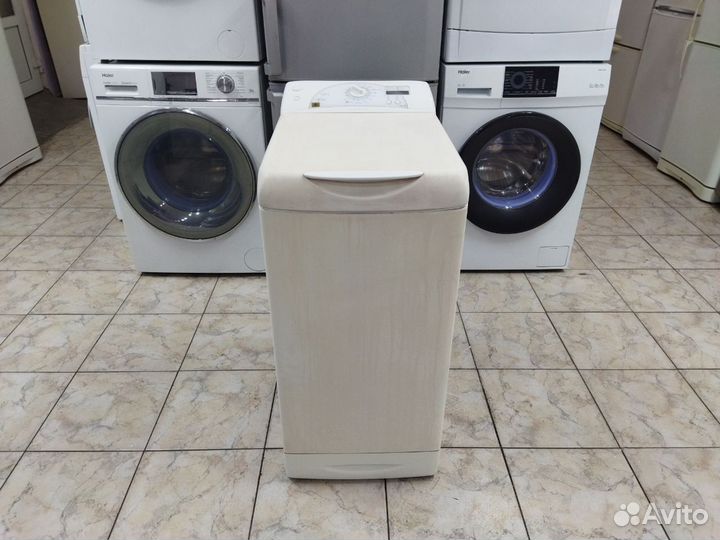 Стиральная машина Ariston с вертикальной загрузкой