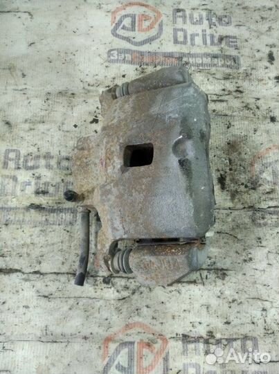 Суппорт тормозной передний левый Mitsubishi Lancer