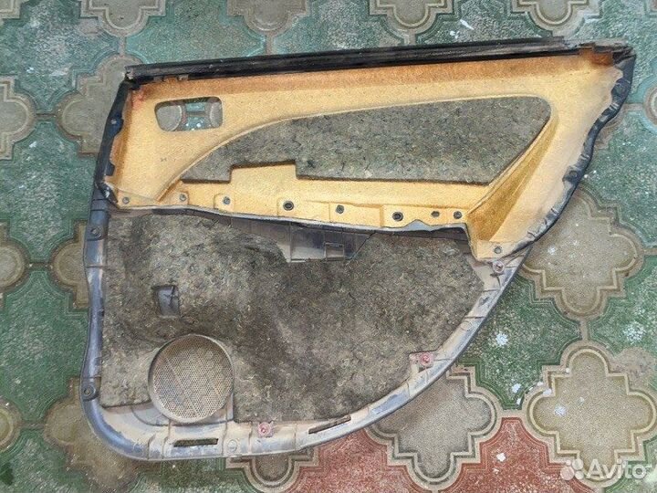 Обшивка боковой двери задняя левая Toyota Caldina