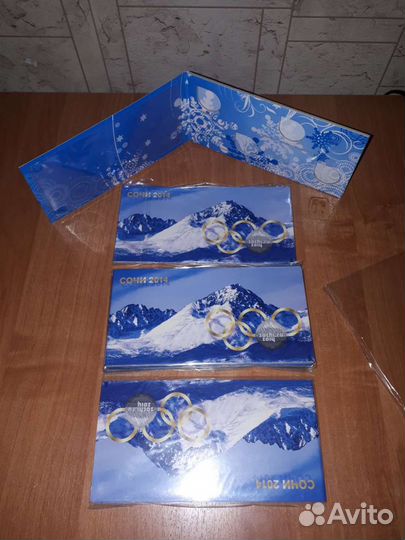 Альбом для 4 монет и +купюра.посвященной Олимпиада