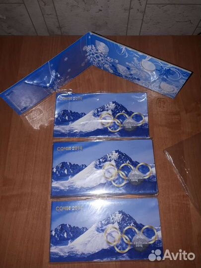 Альбом для 4 монет и +купюра.посвященной Олимпиада