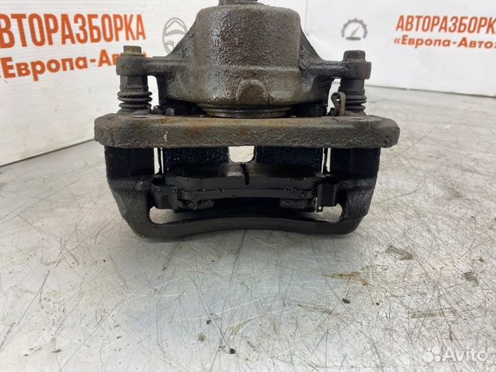 Суппорт тормозной передний левый Kia Magentis 2