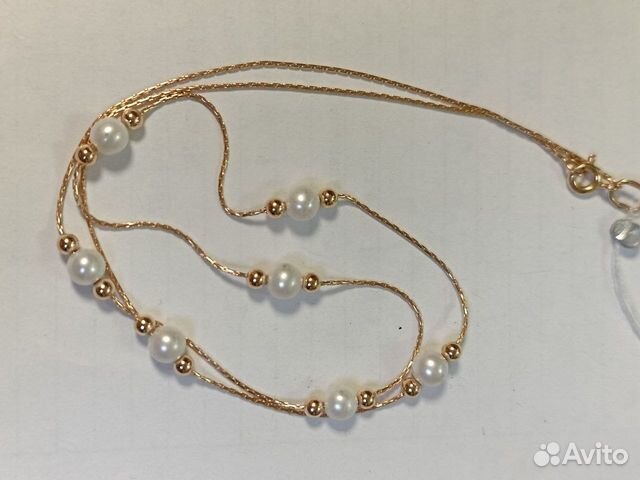 Золотое колье с камнем