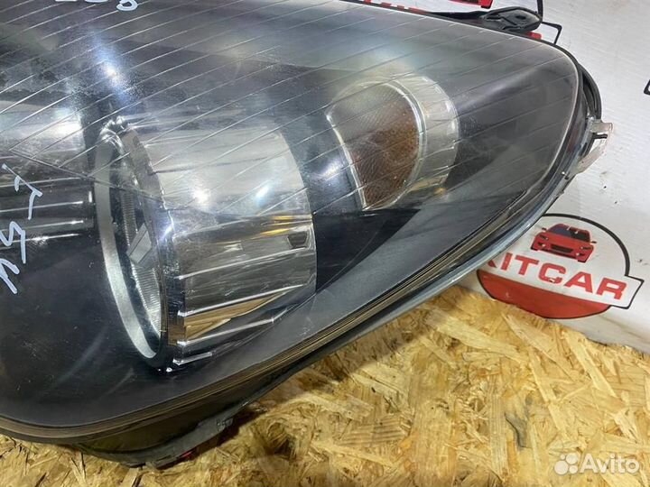 Фара левая Opel Astra H GTC