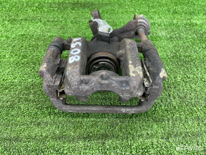 Суппорт тормозной задний левый Opel Astra J GTC