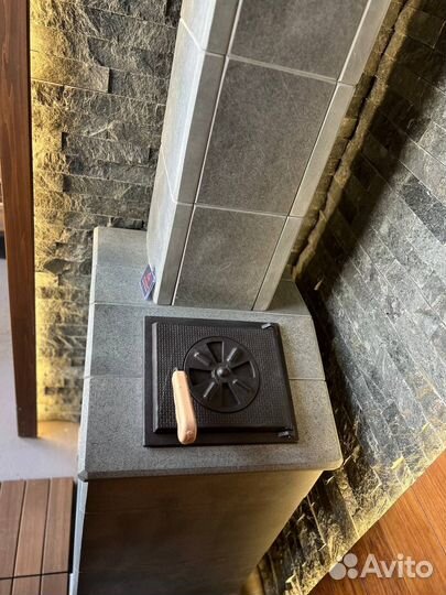 Чугунная печь для бани Гроза Технолит в камне