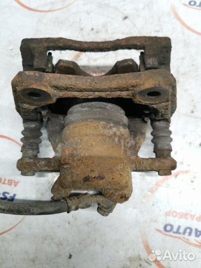 Суппорт тормозной передний правый Nissan Note 1.4