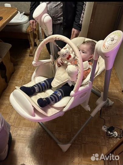 Детский стульчик для кормления с качелей