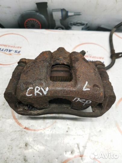Суппорт тормозной передний левый Honda Cr-V 2.0