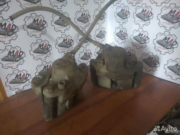 Суппорт тормозной Renault Logan рест. 2010