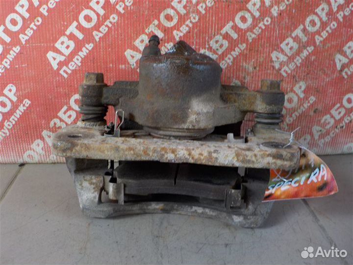 Суппорт тормозной передний левый Kia Spectra