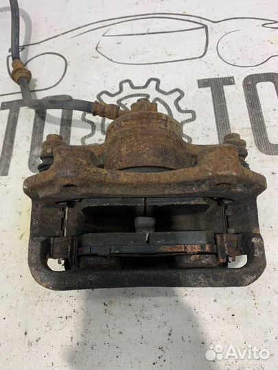 Суппорт передний правый Nissan Almera Classic B10