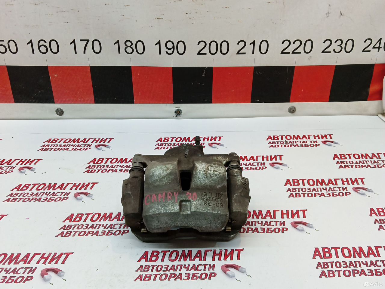 Супорт тормозной передний левый Тойота Камри 70