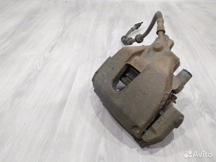 Суппорт тормозной передний правый Ford Focus CB