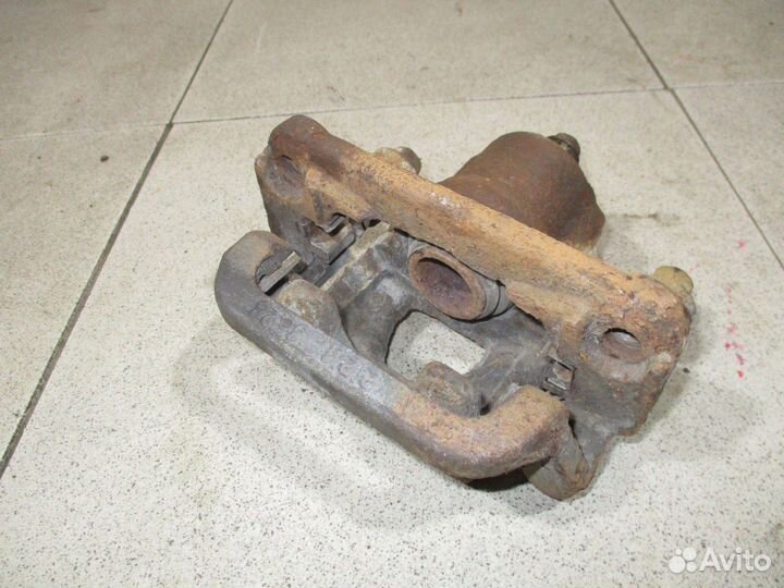 Суппорт задний правый Nissan Tiida (C11)