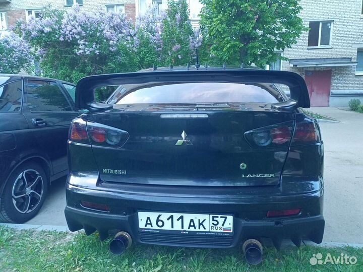 Задний бампер lancer 10 с эво накладкой