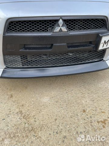 Lancer 10 вставка между клыками новая