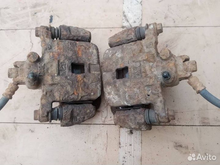 Суппорт тормозной задний Subaru Forester