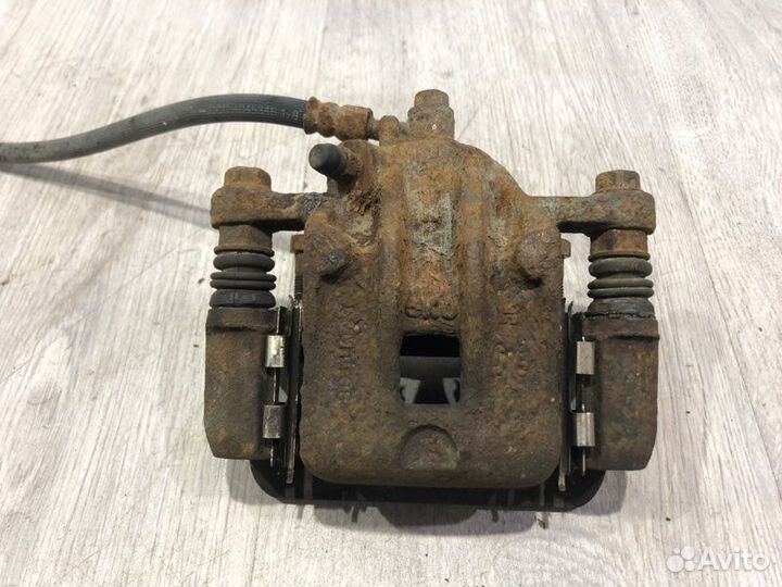 Суппорт тормозной задний правый Hyundai Tucson JM