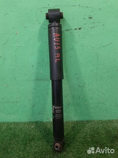 Стойка амортизатора задняя левая Nissan Qashqai J