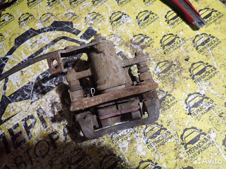 Суппорт тормозной задний левый SsangYong Tivoli