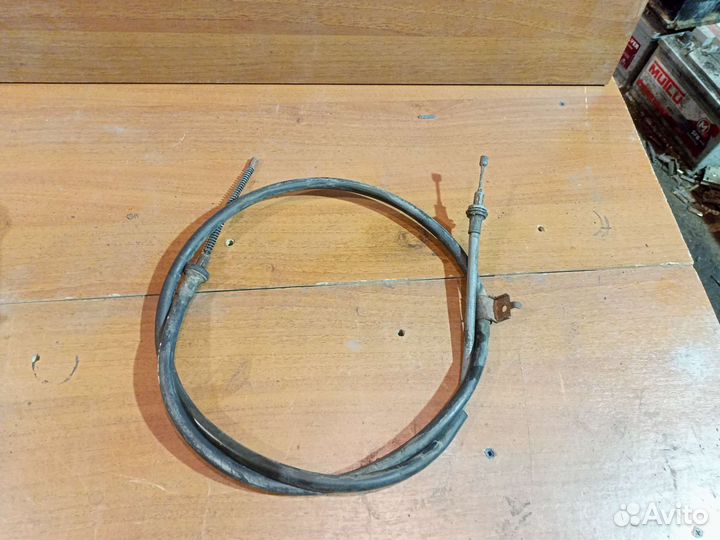 Трос стояночного тормоза левый Nissan Note (E11)