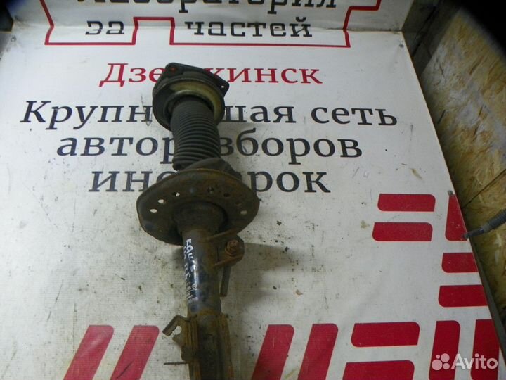 Амортизатор передний левый Nissan Qashqai