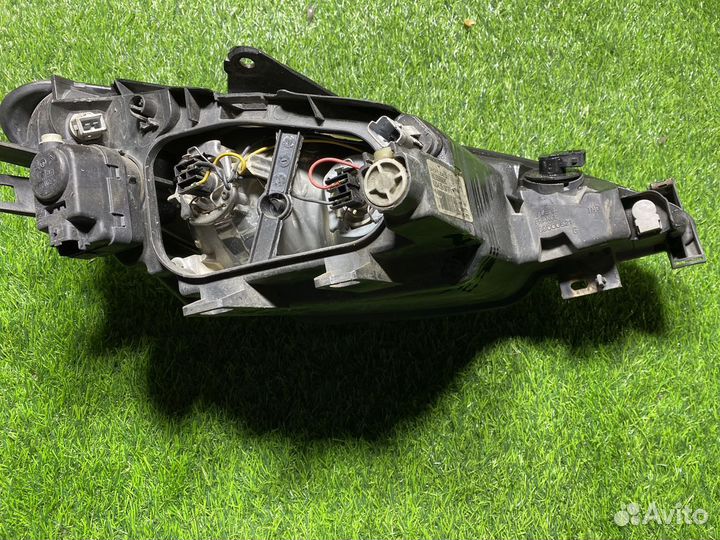 Фара левая Peugeot 206