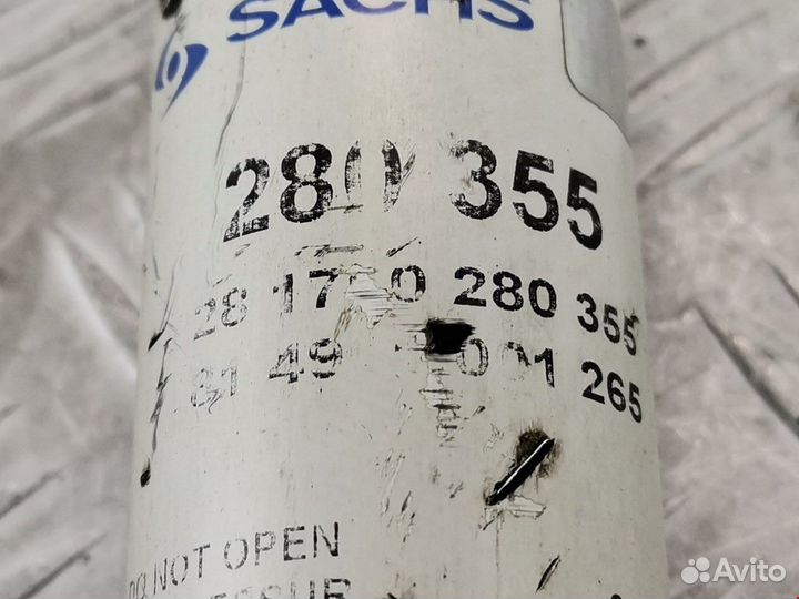 Амортизатор задний левый Ford Focus рест. 2004