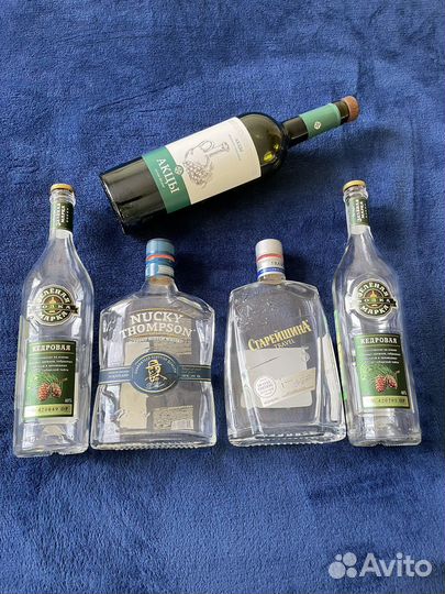 Бутылки с крышками от виски, коньяка, водки, вина