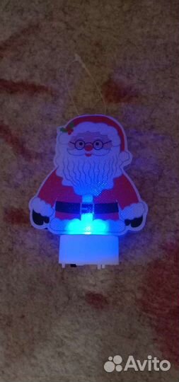 Игрушка дед мороз горит