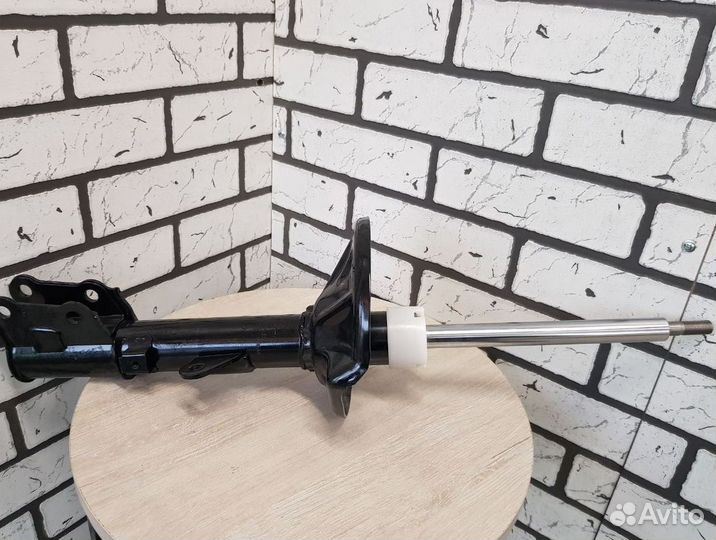 Амортизатор шевроле перед. лев. оригинал