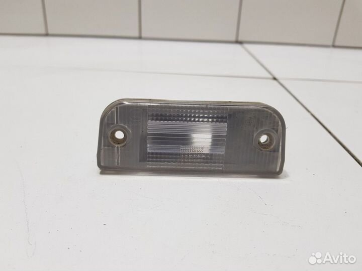 Фонарь подсветки номера левый