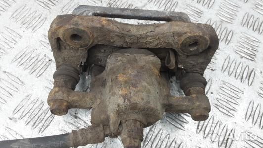 Суппорт тормозной задний правый KIA sportage 2 (EM