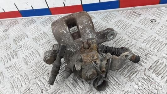 Суппорт тормозной задний правый opel zafira B (JDN