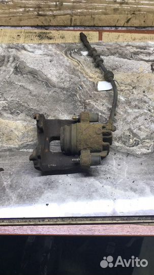 Суппорт тормозной передний левый Ford Focus I (19