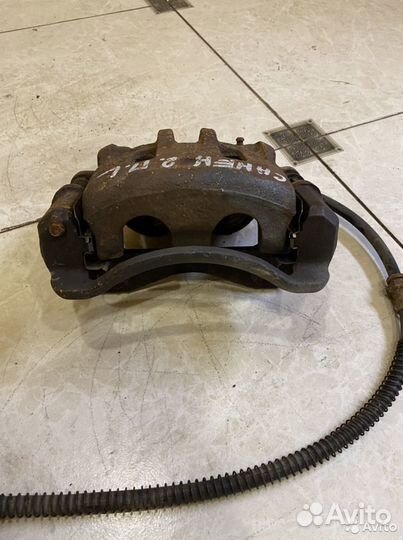 Тормозной суппорт перед лев SsangYong Kyron