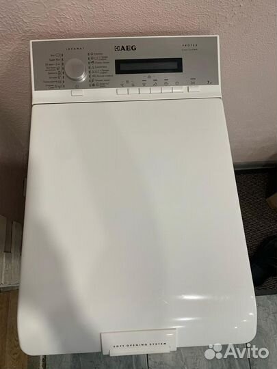 Стиральная машина с вертикальной загрузкой AEG