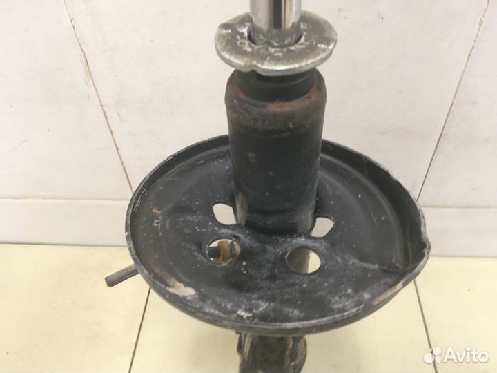 Амортизатор передний левый Carina E 1992-1997