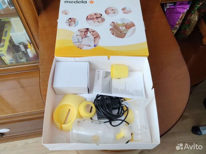 Молокоотсос medela электрический