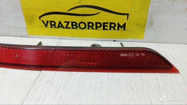 Отражатель в бампер задний правый Opel Astra J