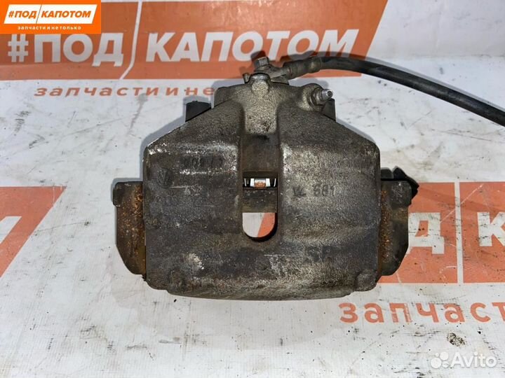 Суппорт тормозной передний левый Volkswagen Caddy