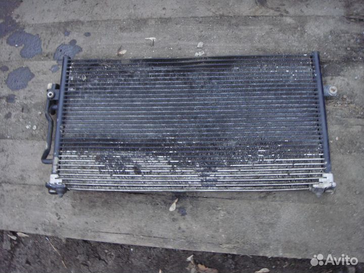 Радиатор кондиционера Mitsubishi Carisma