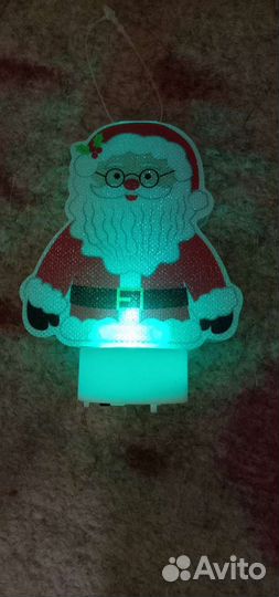 Игрушка дед мороз горит