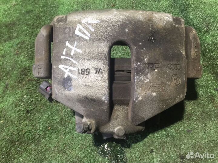 Тормозной суппорт передний левый Volkswagen Passat