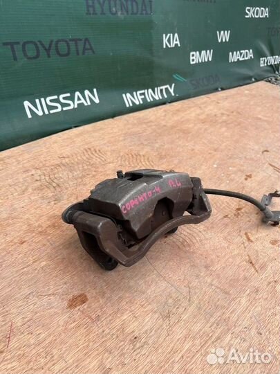 Суппорт тормозной передний левый Kia Sorento 4 4WD