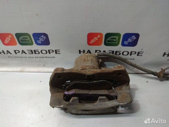 Суппорт передний правый Toyota Corolla E150