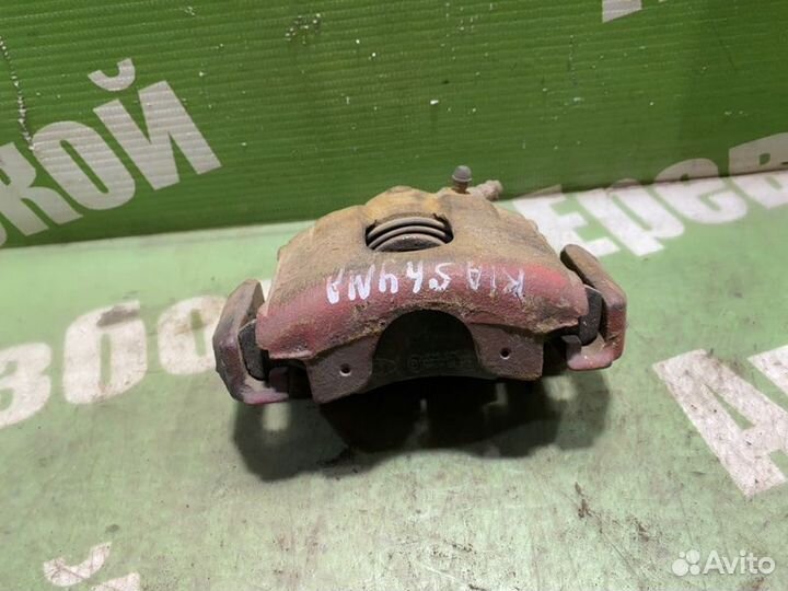 Суппорт тормозной передний левый Kia Shuma