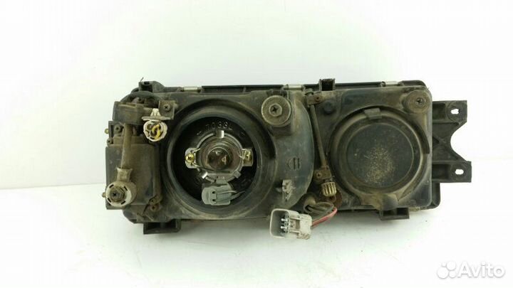 Фара левая Mitsubishi Sigma F16A 6G72 1991